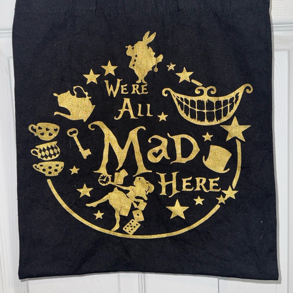 💥SALE ‘We’re All Mad Here” Tote Bag | Alice in Wonderland Quote | Black & Gold - Picture 2 of 7